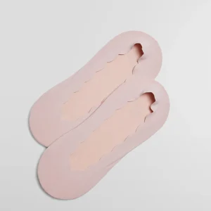 Mignoli invisibili in cotone tinta unita con fascia in silicone rosa