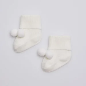 Calzini neonato avorio a coste con nappine