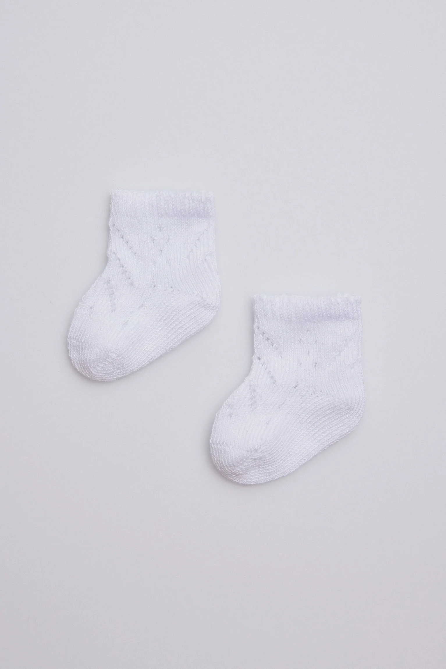 Calzini bianchi con perle neonato - immagine 2