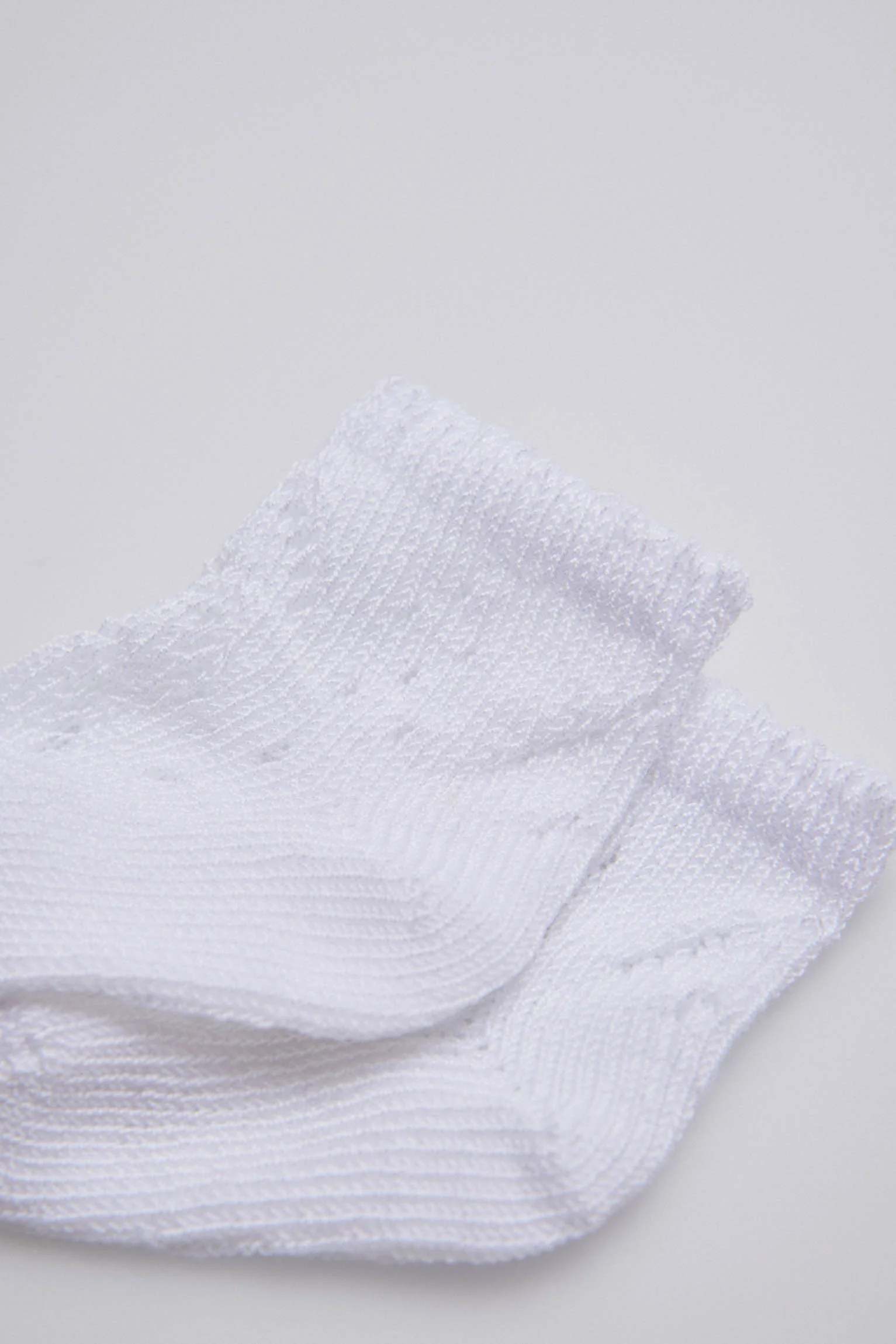 Calzini bianchi con perle neonato - immagine 3