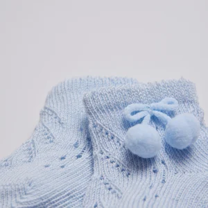 Calzini azzurri con perle neonato con nappine