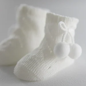 Calzini avorio con perle neonato con nappine