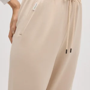 Pantaloni jogger fluidi color avorio