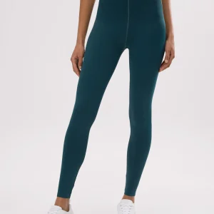 leggings a compressione verde bottiglia per un ventre piatto